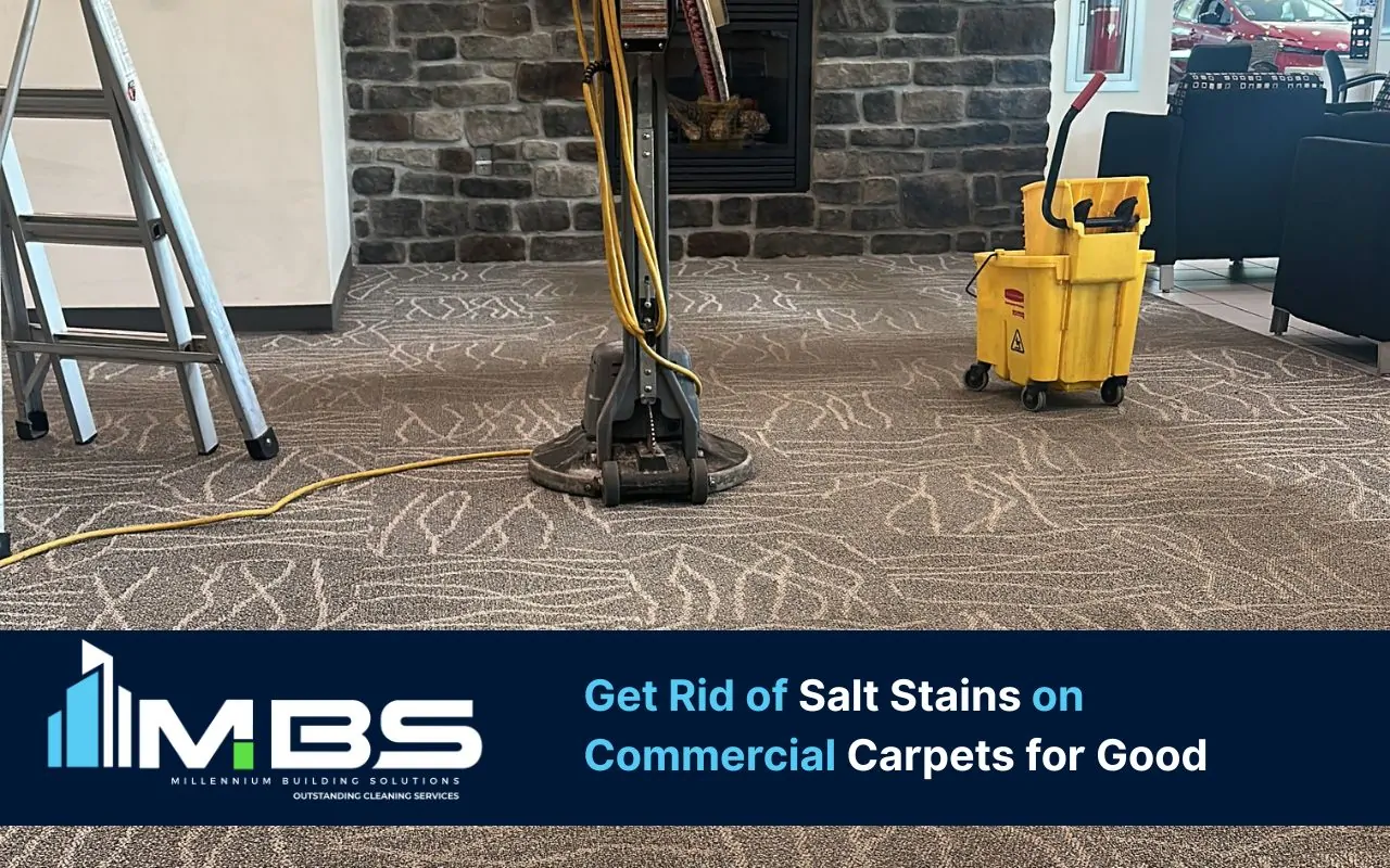 Salt stains on commercial carpets near a busy entryway being cleaned by Millennium Building Solutions LLC